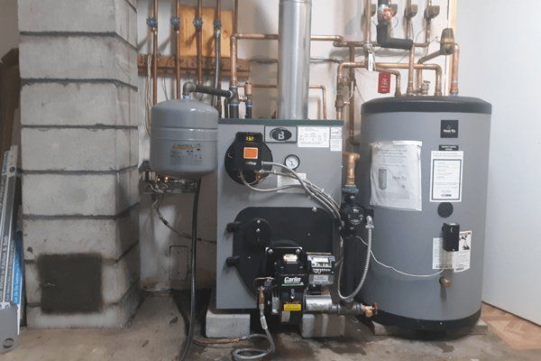 A modern Buderus boiler and Heat-Flo water heater installed by Gottier